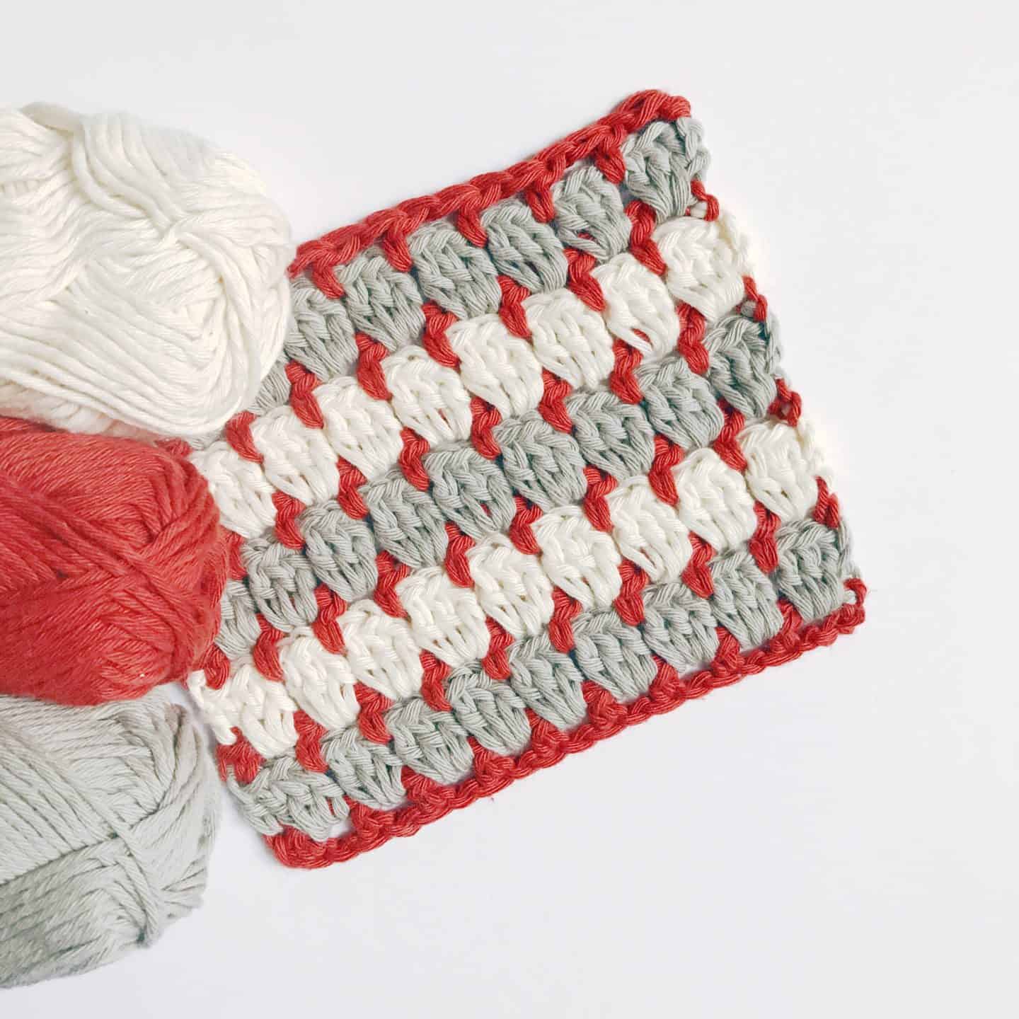 Learn to crochet the granny block crochet stitch with this easy step by step crochet tutorial for beginners. A twist on the classic crochet granny square, the granny block stitch is worked in rows instead of rounds and so is much easier to master. The free crochet blanket pattern and stitch tutorial are in both US and UK crochet terms. 