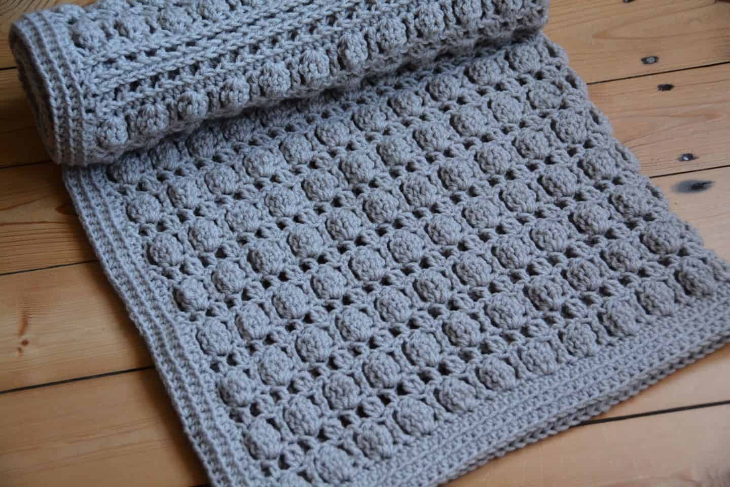 Oyster Shell Blanket free crochet pattern by Hannah Cross. Learn to crochet the cluster stitch, free baby crochet blanket pattern. Easy crochet blanket pattern.