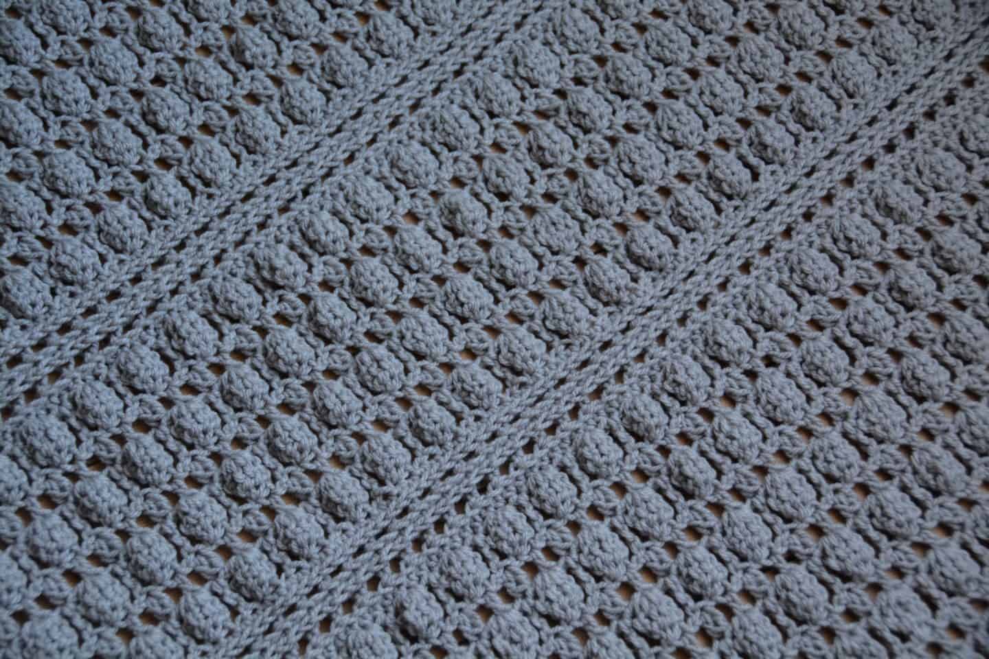 Oyster Shell Blanket free crochet pattern by Hannah Cross. Learn to crochet the cluster stitch, free baby crochet blanket pattern. Easy crochet blanket pattern.