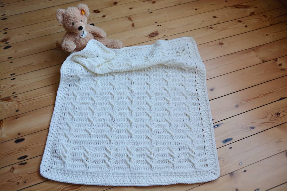 Cleo's Cloud Blanket a free crochet blanket pattern by Hannah Cross HanJan Crochet. Learn to crochet an heirloom baby blanket. Cream plain baby crochet blanket. 