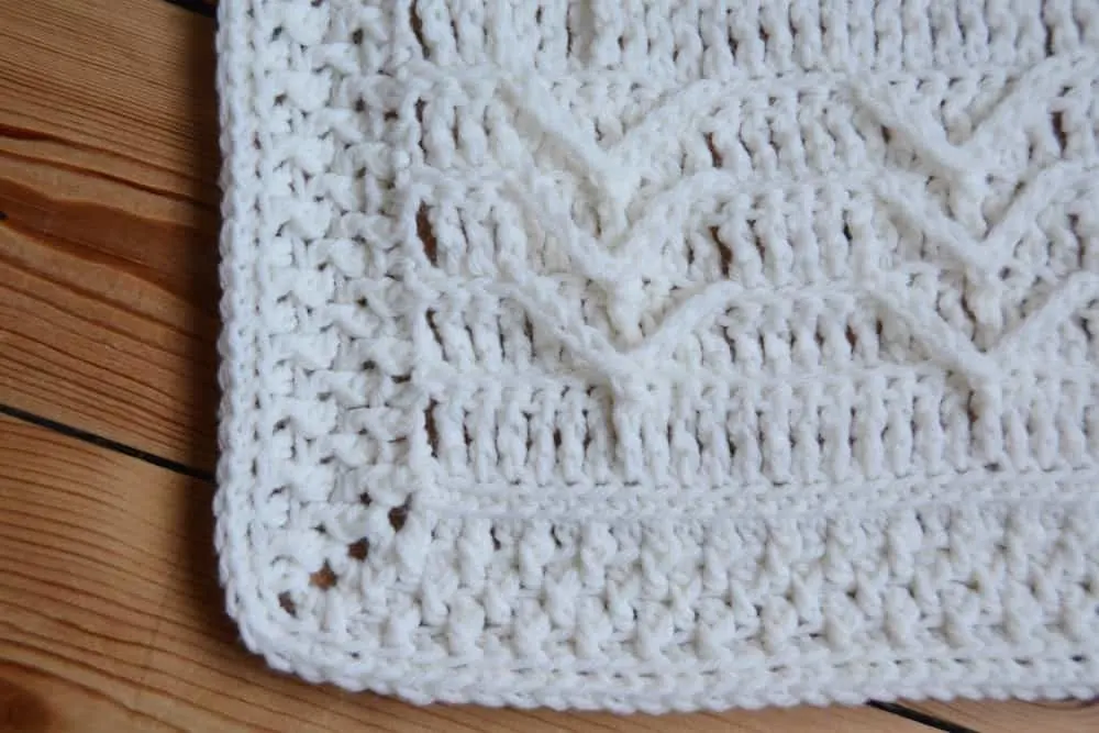 Cleo's Cloud Blanket a free crochet blanket pattern by Hannah Cross HanJan Crochet. Learn to crochet an heirloom baby blanket. Cream plain baby crochet blanket.