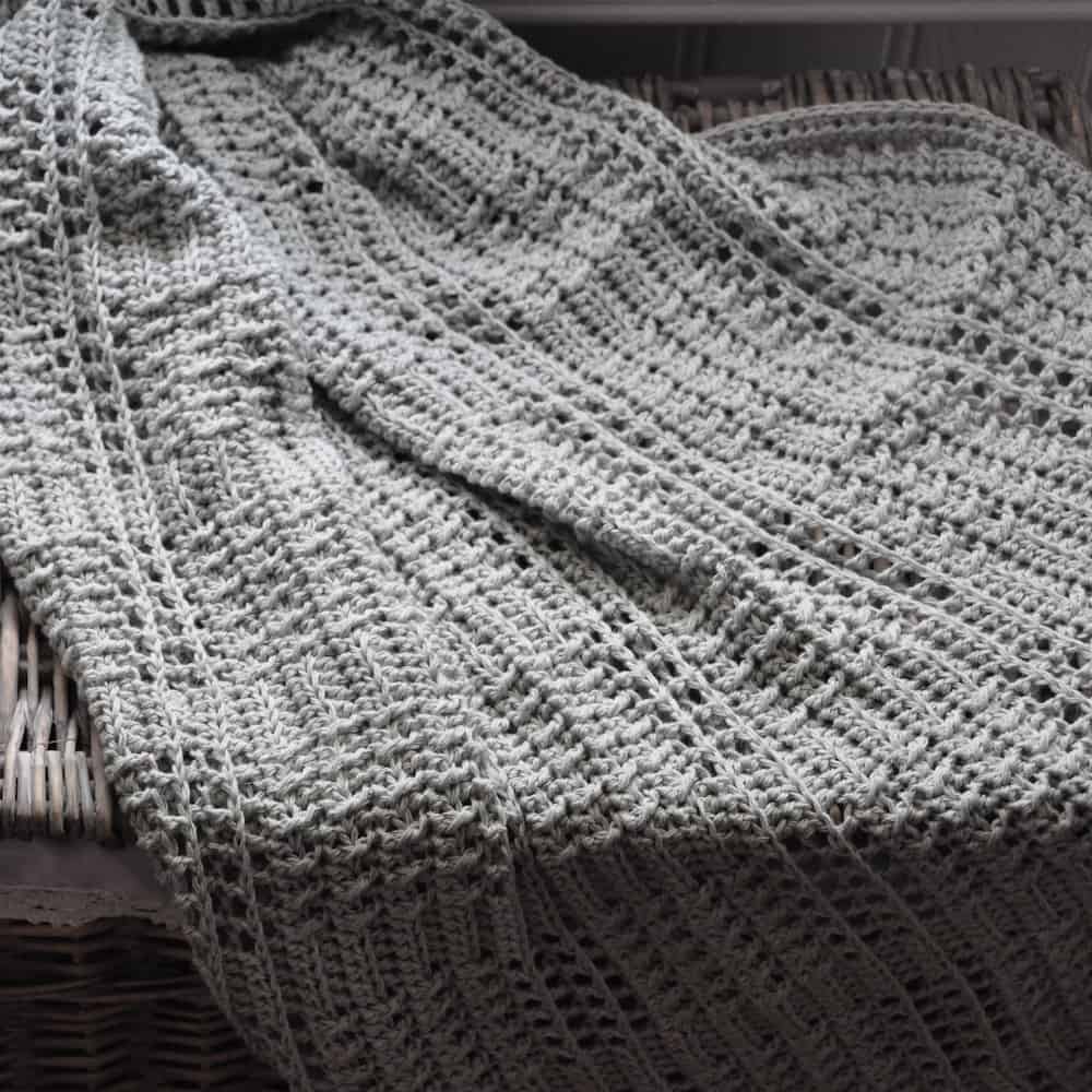 The Silver Squares Crochet Baby Blanket, a free beginners crochet pattern by HanJan Crochet, Hannah Cross. Learn to crochet this classic and easy baby blanket. 