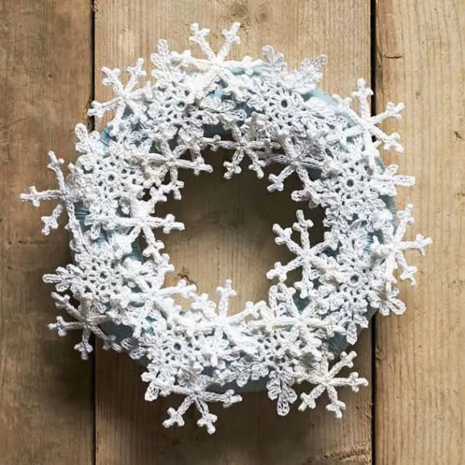 Crochet snowflake wreath on a door.