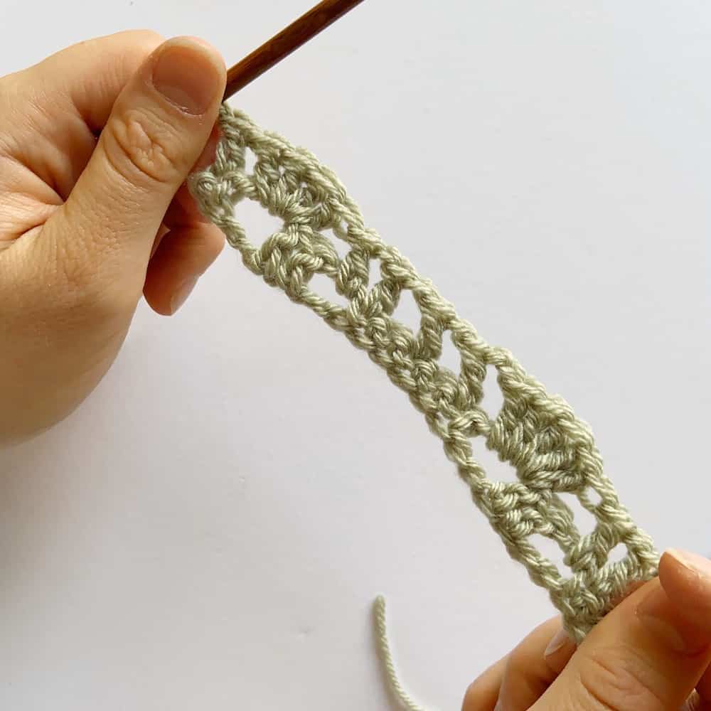 Learn to crochet this beautiful Lacy Wave crochet stitch with Hannah Cross of HanJan Crochet. Learn with step by step images and pattern to create a delicate and light lace crochet stitch. 