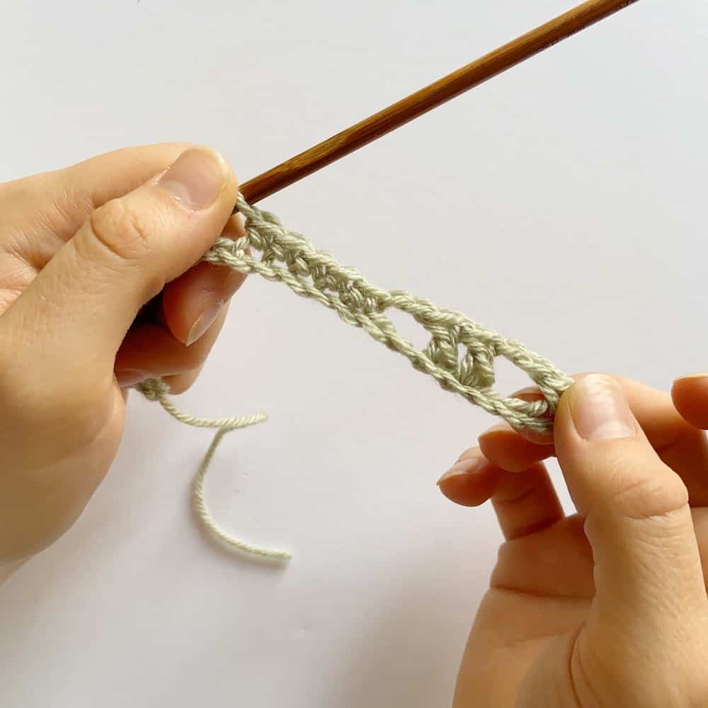 Learn to crochet this beautiful Lacy Wave crochet stitch with Hannah Cross of HanJan Crochet. Learn with step by step images and pattern to create a delicate and light lace crochet stitch. 