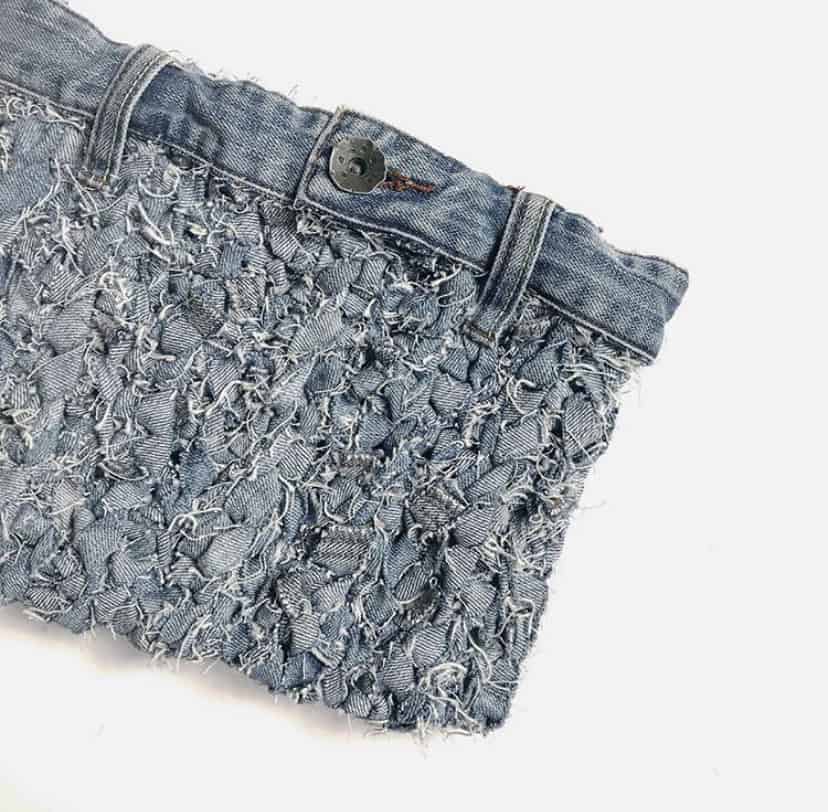 How to make jeans yarn and then crochet it into a fabulous denim clutch bag. A free how to tutorial and crochet pattern from HanJan Crochet.