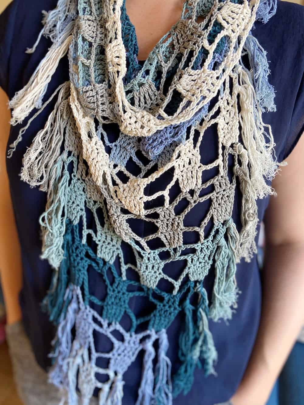 The Seaglass Bandana Scarf is a free triangular crochet scarf pattern that ends up with straight edges that you join to form a cowl part at the top. Sounds complicated?! I promise it's not. 
