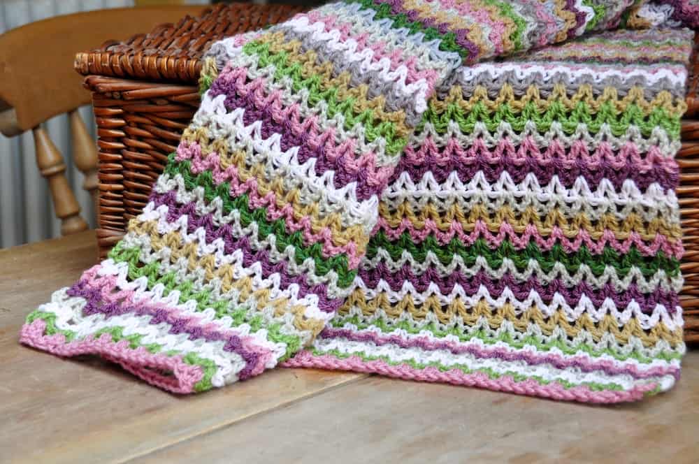 Learn to crochet six different free beginner crochet blanket patterns. Get advice on where to start, what crochet hooks and yarn you need and learn the V stitch, ripple stitch, granny block stitch, larksfoot stitch, cabbage patch stitch and cable stitch in these easy crochet patterns and tutorials. 