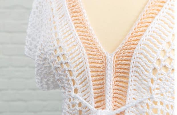 Learn to crochet the effortless Peachy Bikini Cover Up Top with this easy free crochet pattern. The super simple construction consists of just two long panels of filet crochet, slip stitch detailing and long triple treble crochet stitches which make a really pretty, delicate fabric that is so easy to both make and wear. Perfect for days by the pool, lazy days in the garden with shorts or to dress up with heels for a night out.