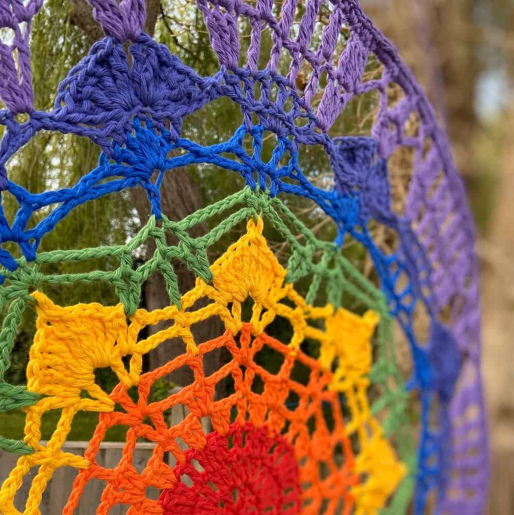 Add a burst of colour to your life with this beautiful crochet rainbow mandala hanging pattern by HanJan Crochet. It's the perfect wall hanging or door hanging to give a pop of colour and energy to your home. A free crochet mandala pattern for everyone to enjoy.