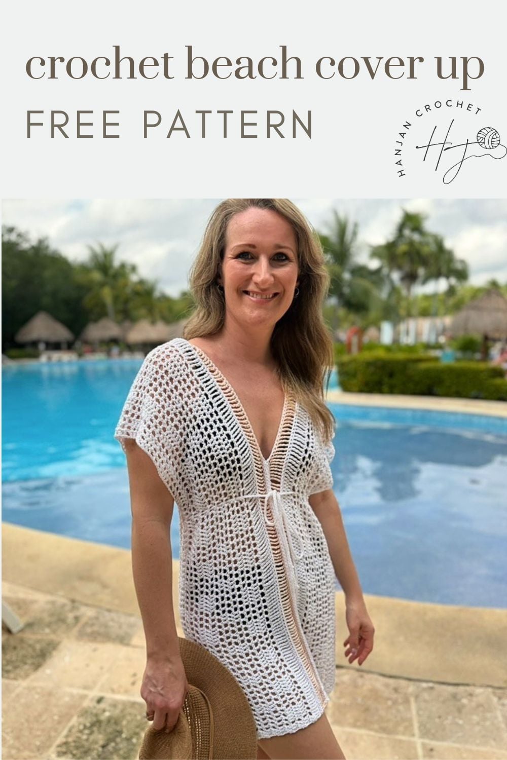 Woman wearing a white bikini cover up crochet pattern stands by a pool, holding a sunhat. Text above reads "crochet beach cover up FREE PATTERN." Palm trees and buildings in the background.