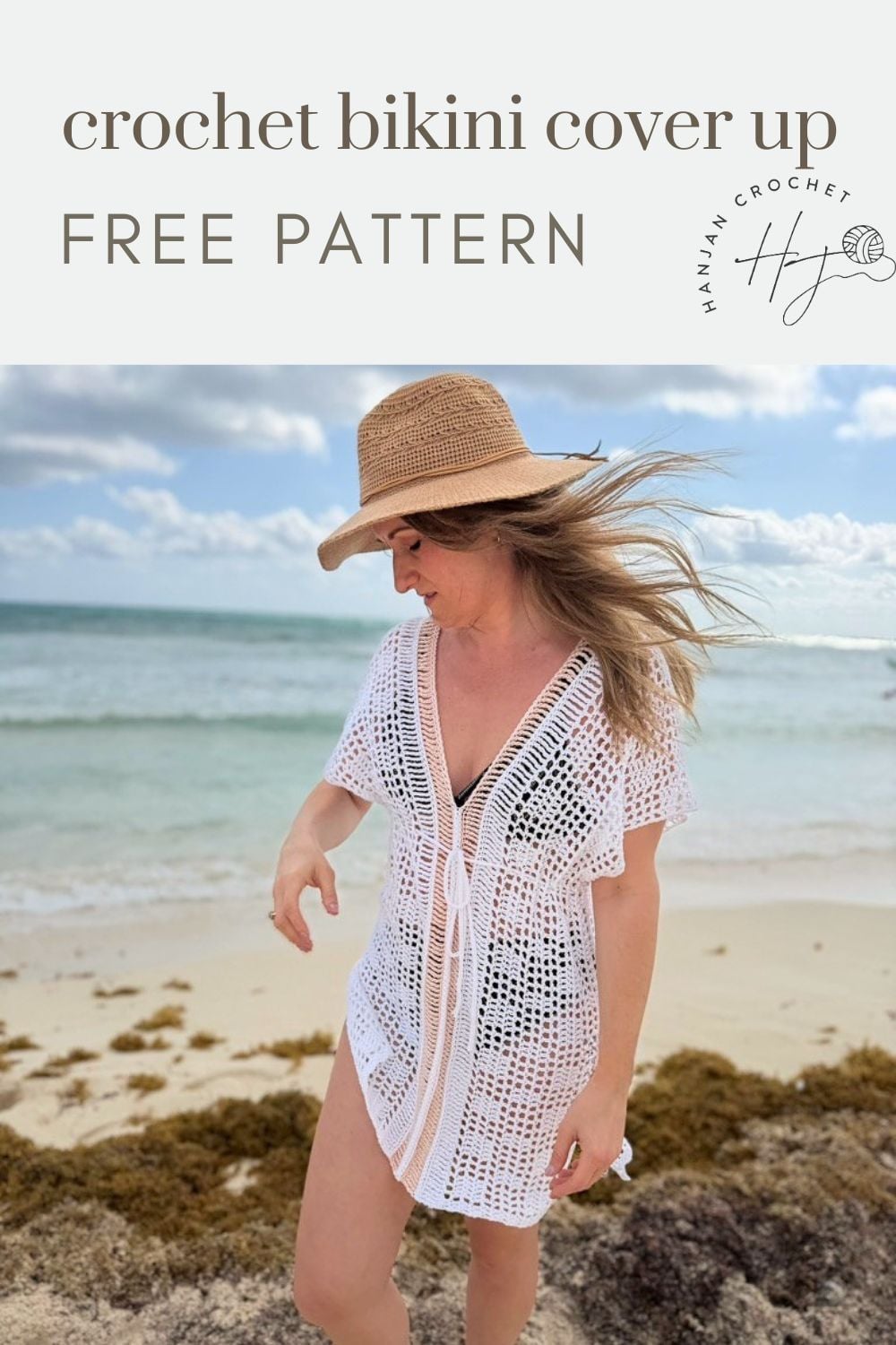 Woman wearing a white crochet bikini cover-up and straw hat stands on a sandy beach with the ocean in the background. Text reads "bikini cover up crochet pattern FREE PATTERN.