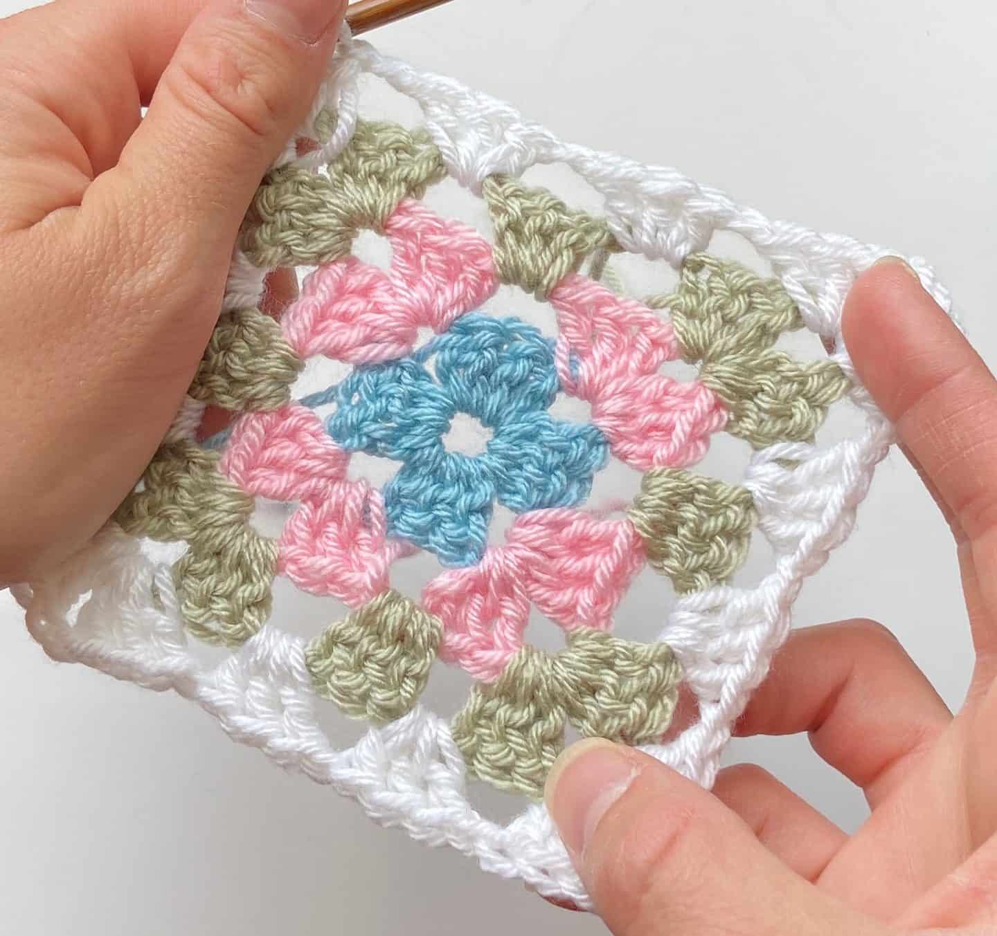 Four round crochet granny square motif.