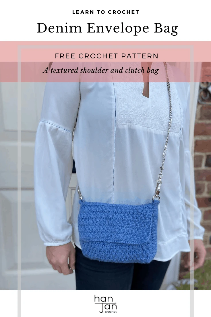 Cross body denim blue crochet bag on woman in white shirt.