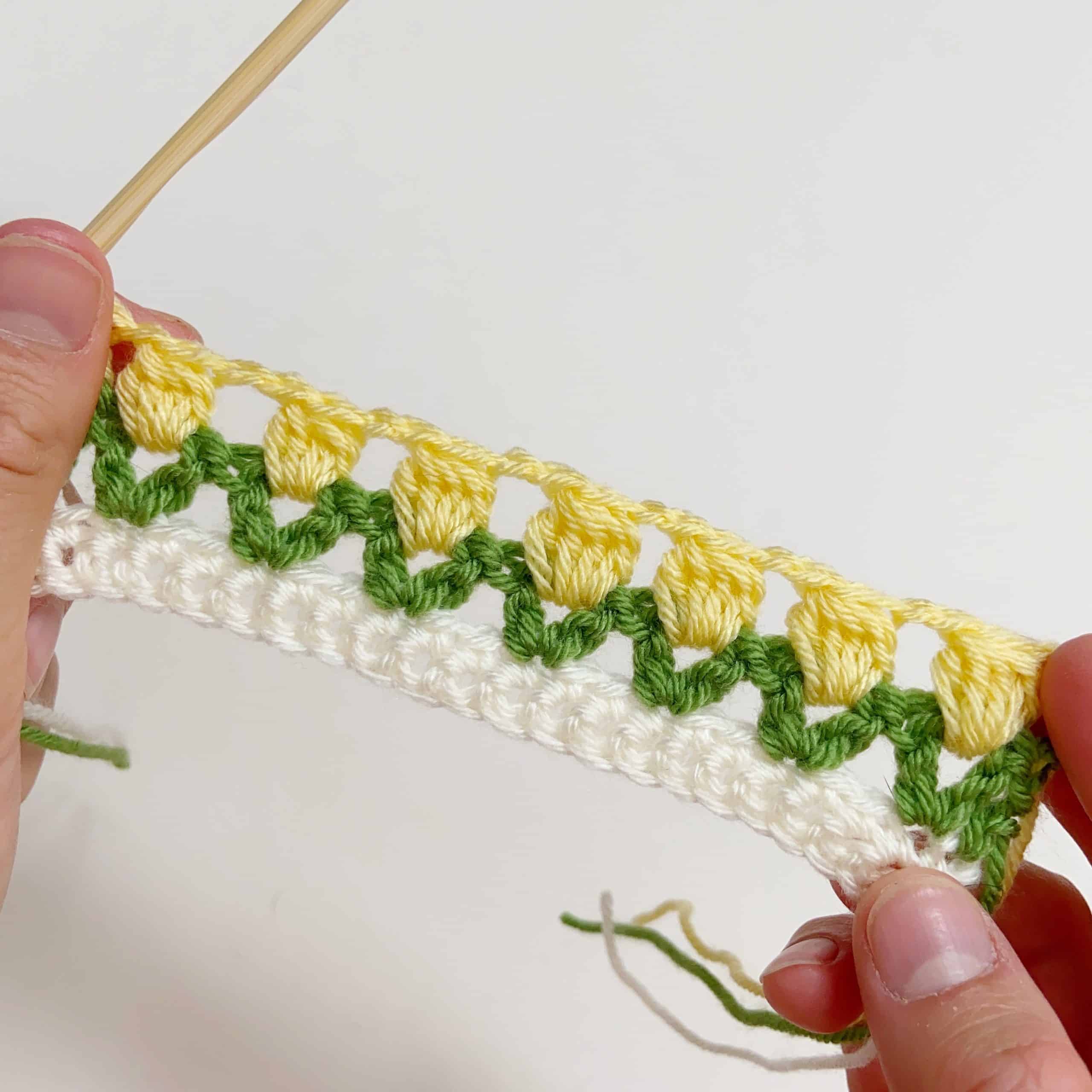 row of crochet cluster stitches