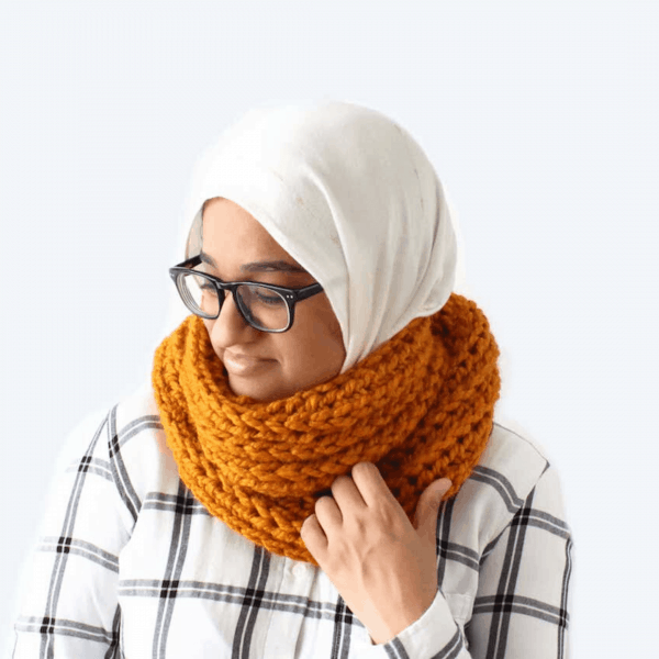 yellow crochet scarf on woman in glasses with headscarf