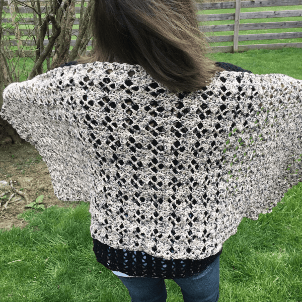 cream lace crochet cardigan on woman facing backwards