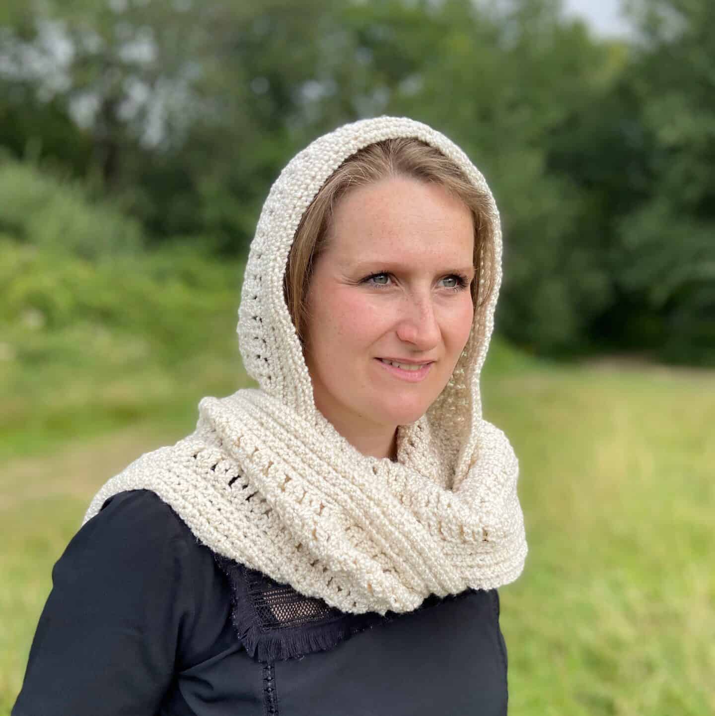 woman wearing cream crochet hood and scarf