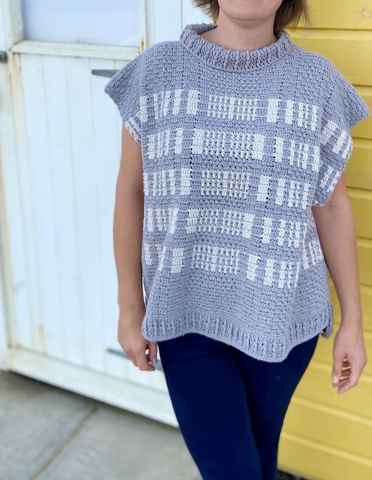 close up of grey and white textured crochet poncho pattern