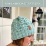 woman wearing mint green simple crochet cable hat, a winter beanie