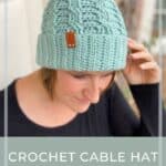 woman wearing mint green simple crochet cable hat, a winter beanie