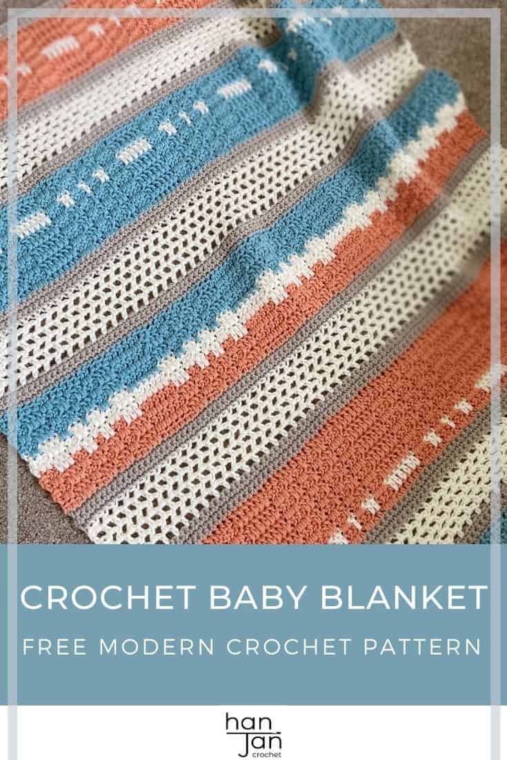 Peach and teal crochet blanket laying on floor.