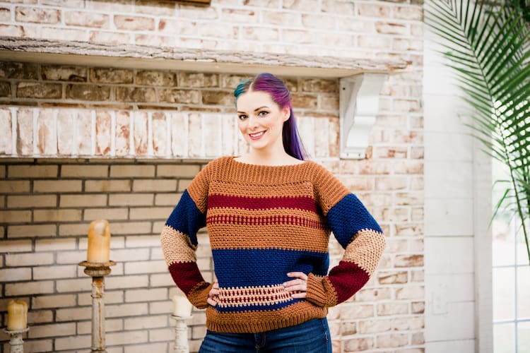 woman with blue and pink hair wearing crochet gingerbread pullover jumper 