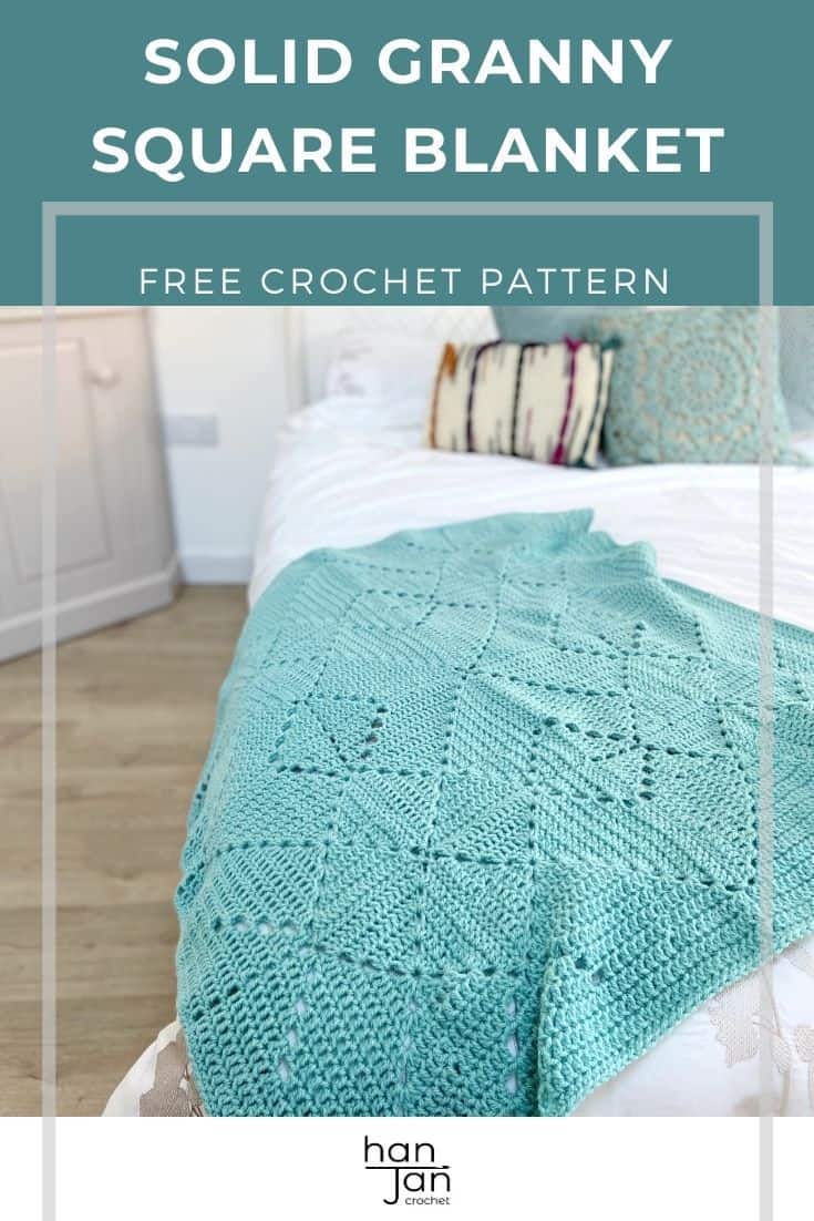 Washed teal crochet beginner blanket laying on end of bed.