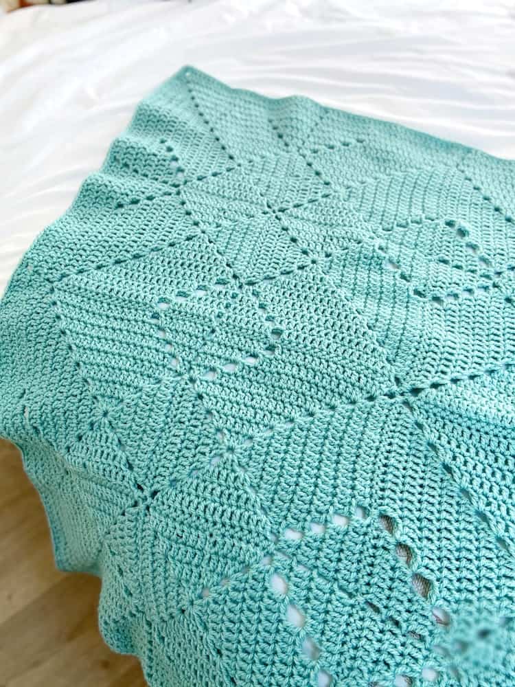 Teal crochet solid granny square motif blanket.