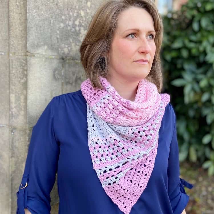 woman wearing pink and grey lace crochet shawl