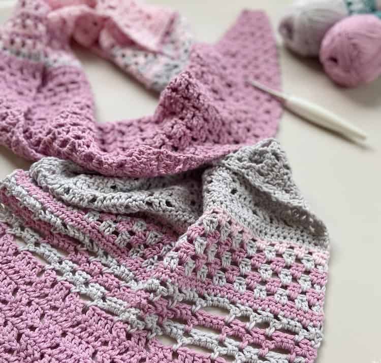 pink and grey summer lace crochet shawl with crochet hook and yarn
