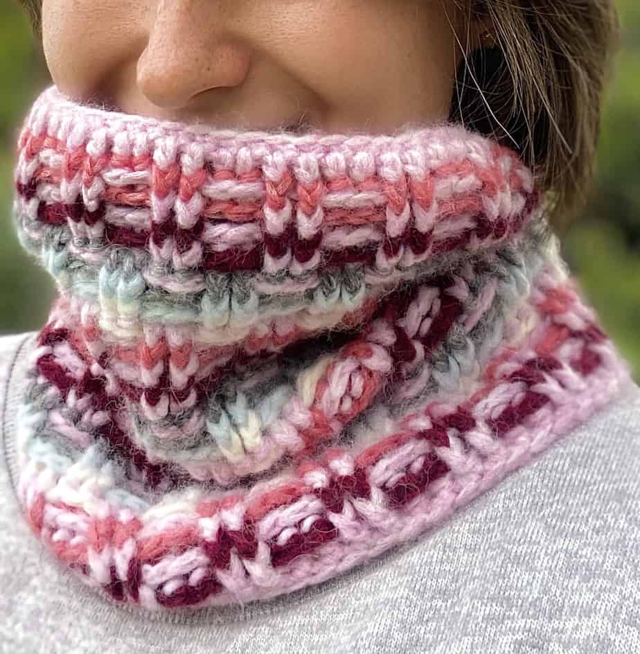 close up of woman wearing cozy winter crochet cowl