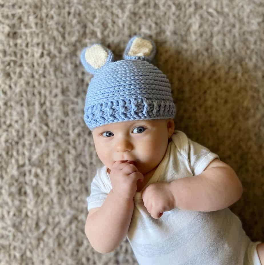 cute baby wearing baby bunny crochet hat in blue