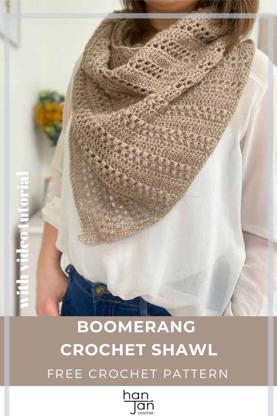woman wearing white shirt, jeans and textured crochet boomerang shawl with hands in pockets.