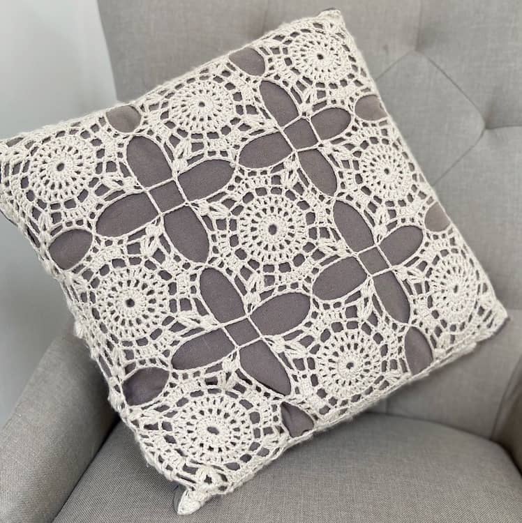 crochet lace square motif cushion in grey and white