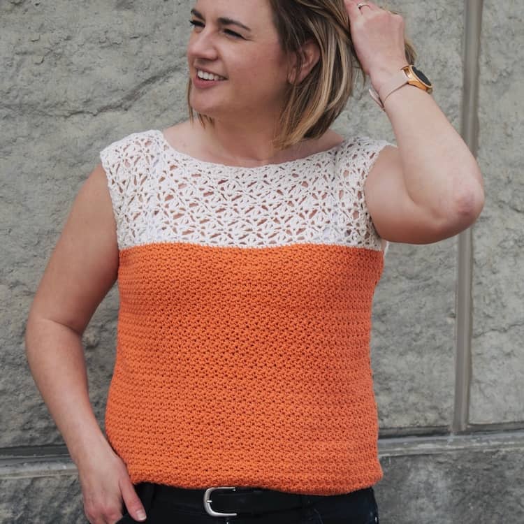 woman wearing orange and white crochet top