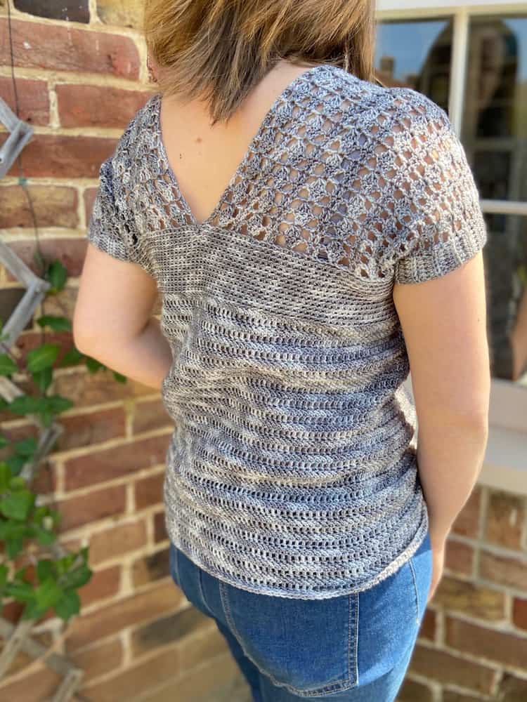 back view of woman wearing seamless lace crochet top