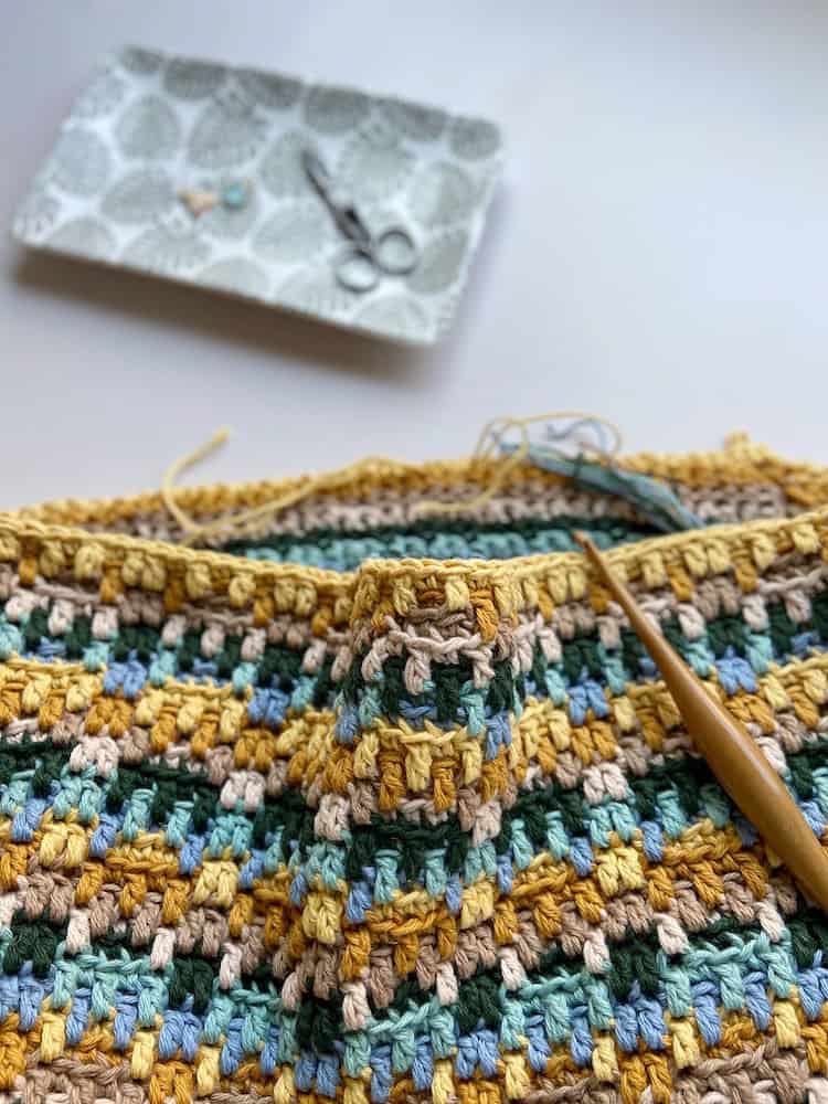 progress of mosaic crochet bag with wooden crochet hook