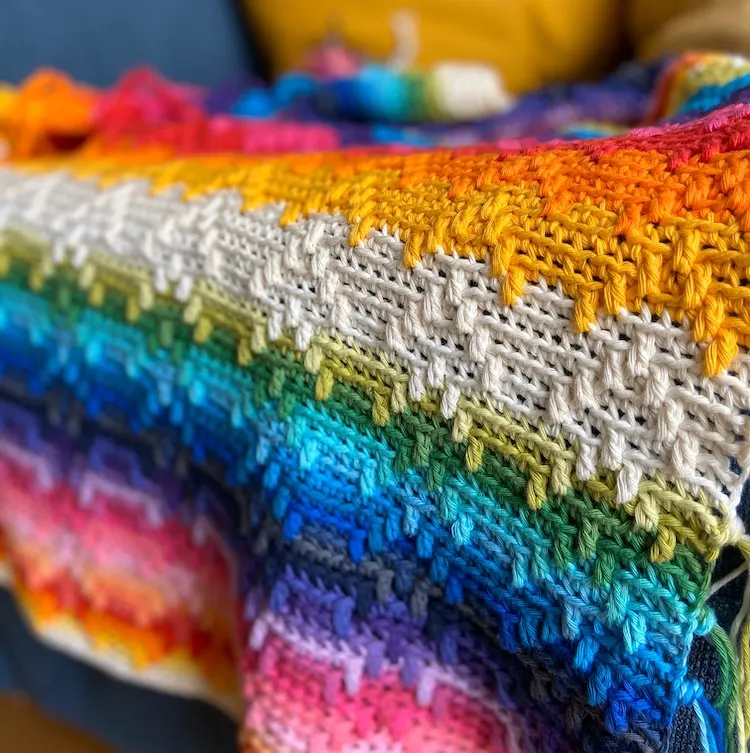 detail of overlay mosaic crochet blanket in rainbow colours