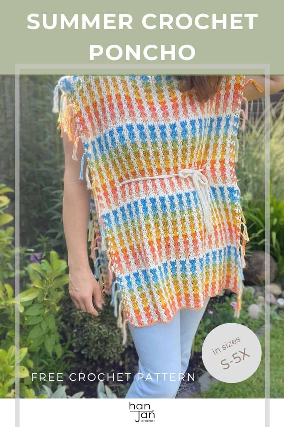 woman wearing pastel coloured crochet poncho and light blue jeans