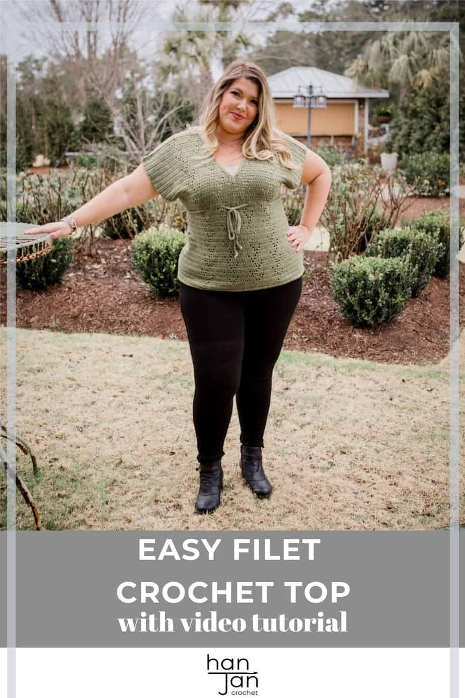 blonde woman standing in garden wearing green filet crochet summer t-shirt and black trousers