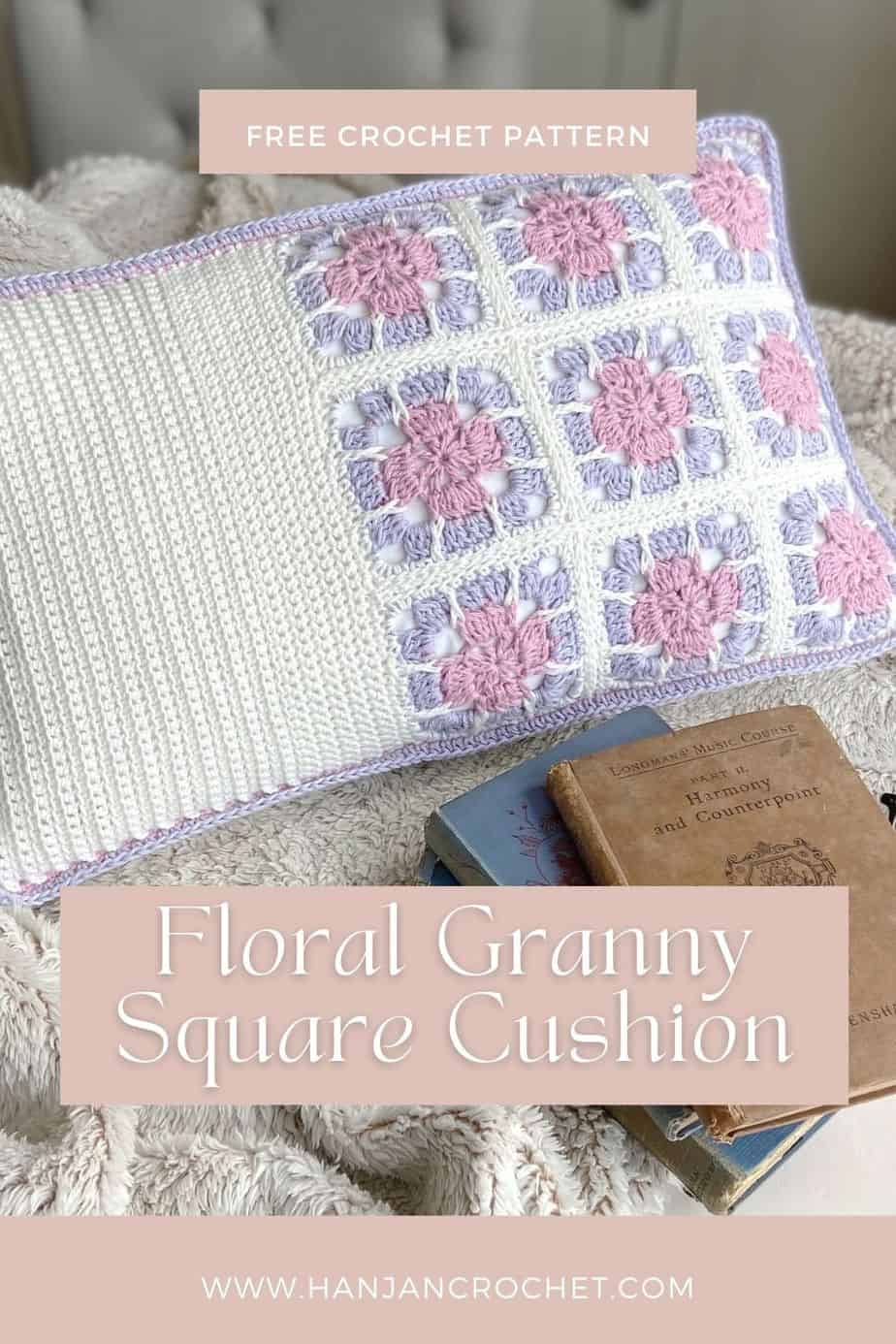 pink, lilac and whit floral granny square pillow with books and fluffy blanket