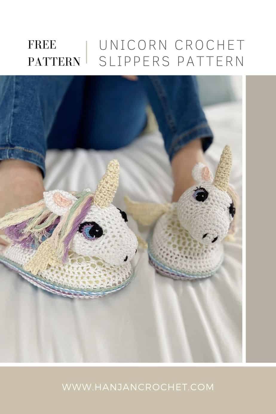 pair of unicorn crochet slippers being worn by someone in jeans sitting on a bed