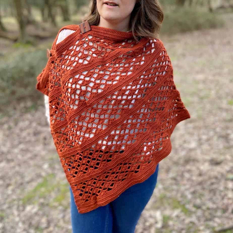 woman wearing lace crochet poncho style wrap