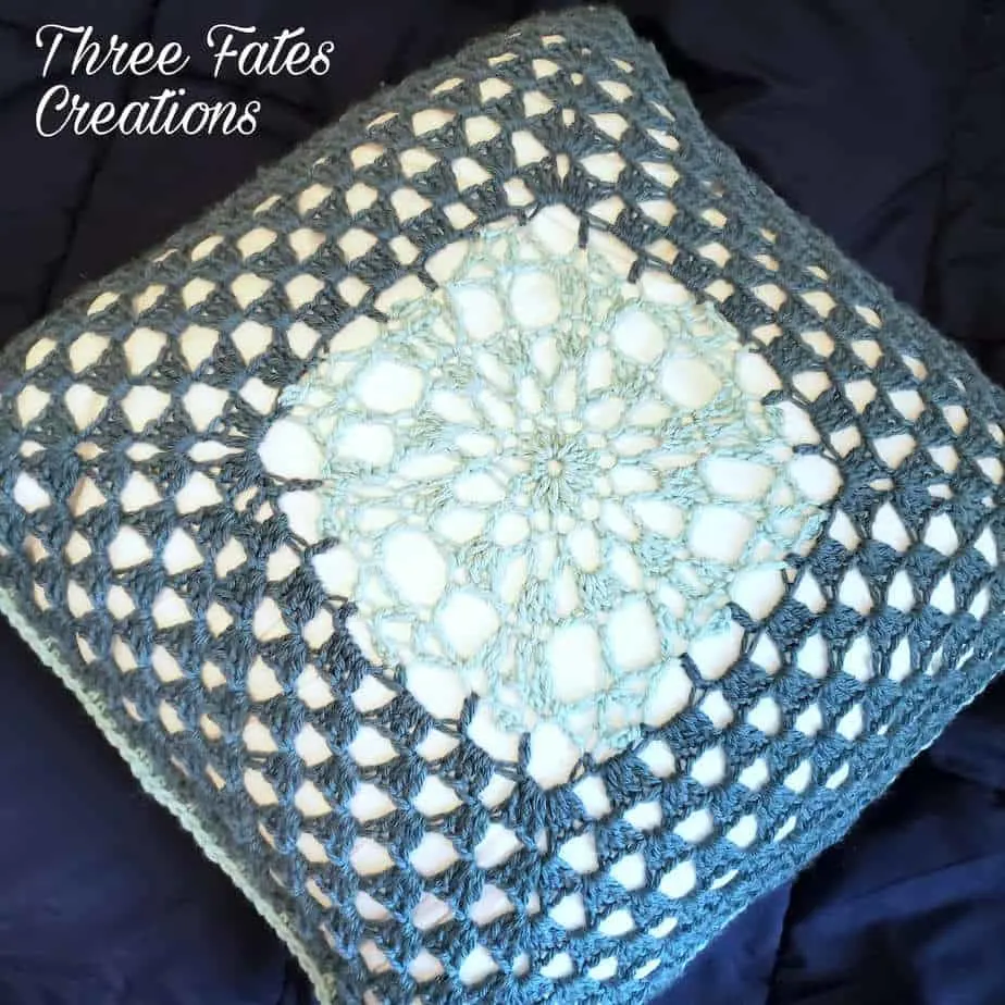 Pillow with crochet cover.