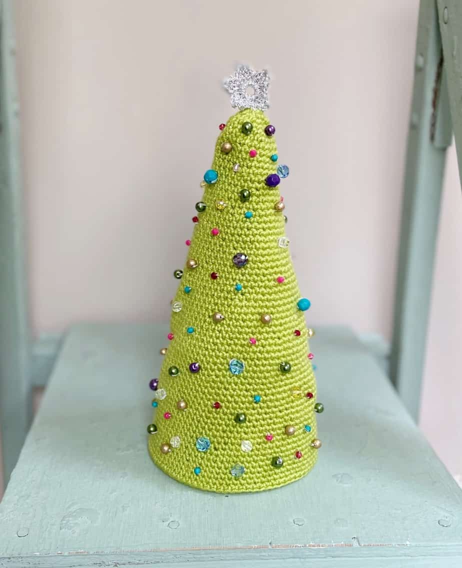 close up of Beaded Amigurumi Crochet Christmas Tree Pattern on wooden ladder