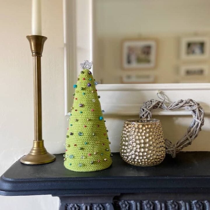 beaded amigurumi crochet Christmas tree on mantle piece