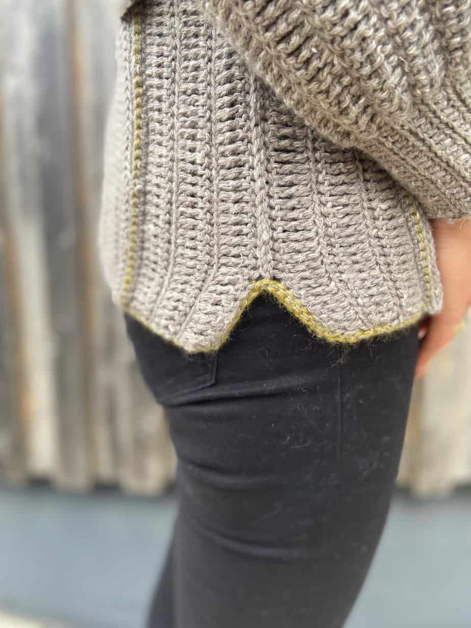 close up of hem detail on grey crochet modern sweater pattern