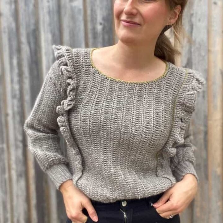 woman wearing grey ruffle easy crochet sweater