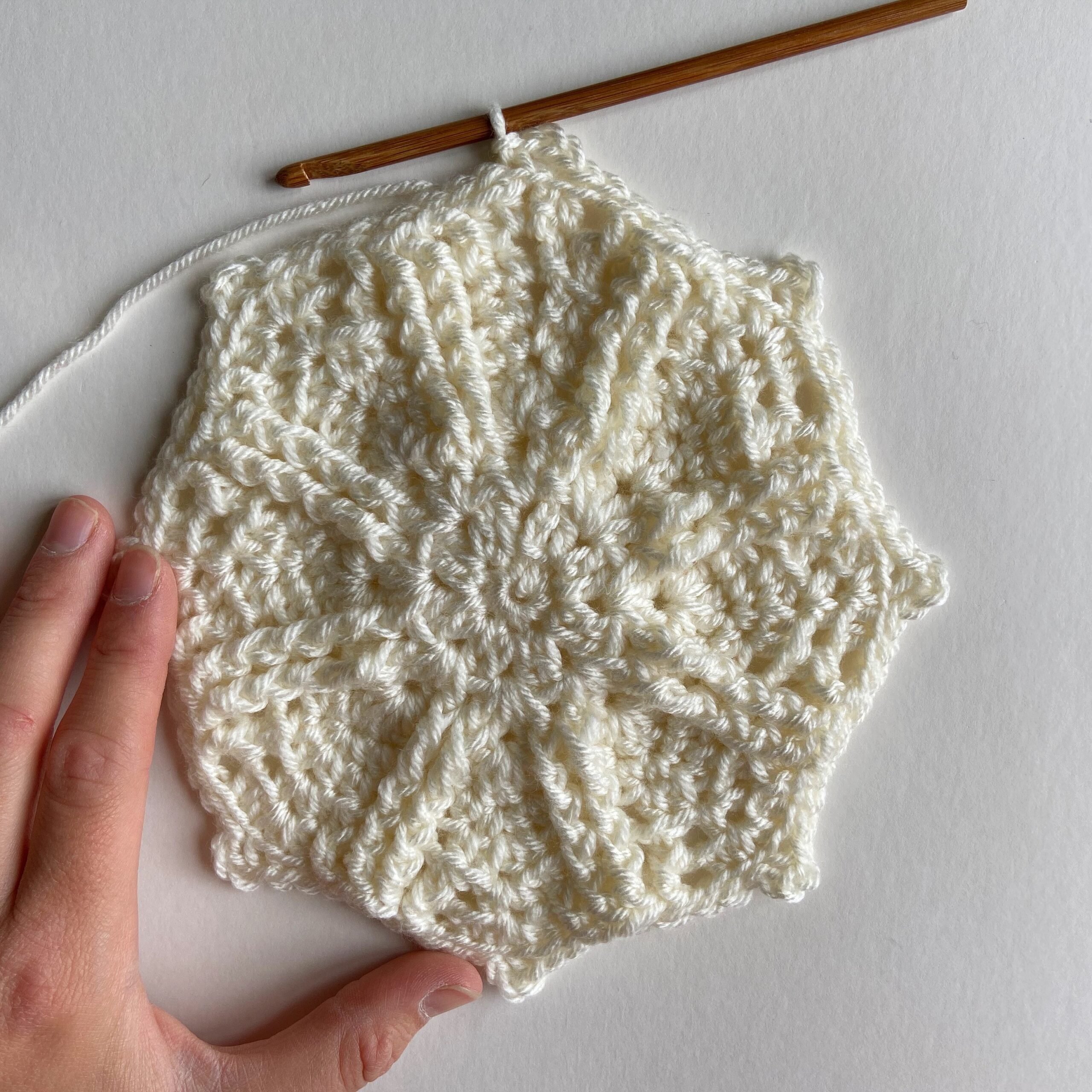close up of cream crochet octagon motif with front post stitches 